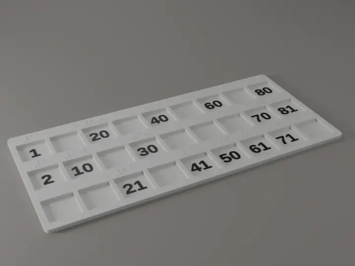 Render of a white banko plate at an angle: three rows of nine square fields, black numbers in the filled fields and raised braille dots on the border above each number.